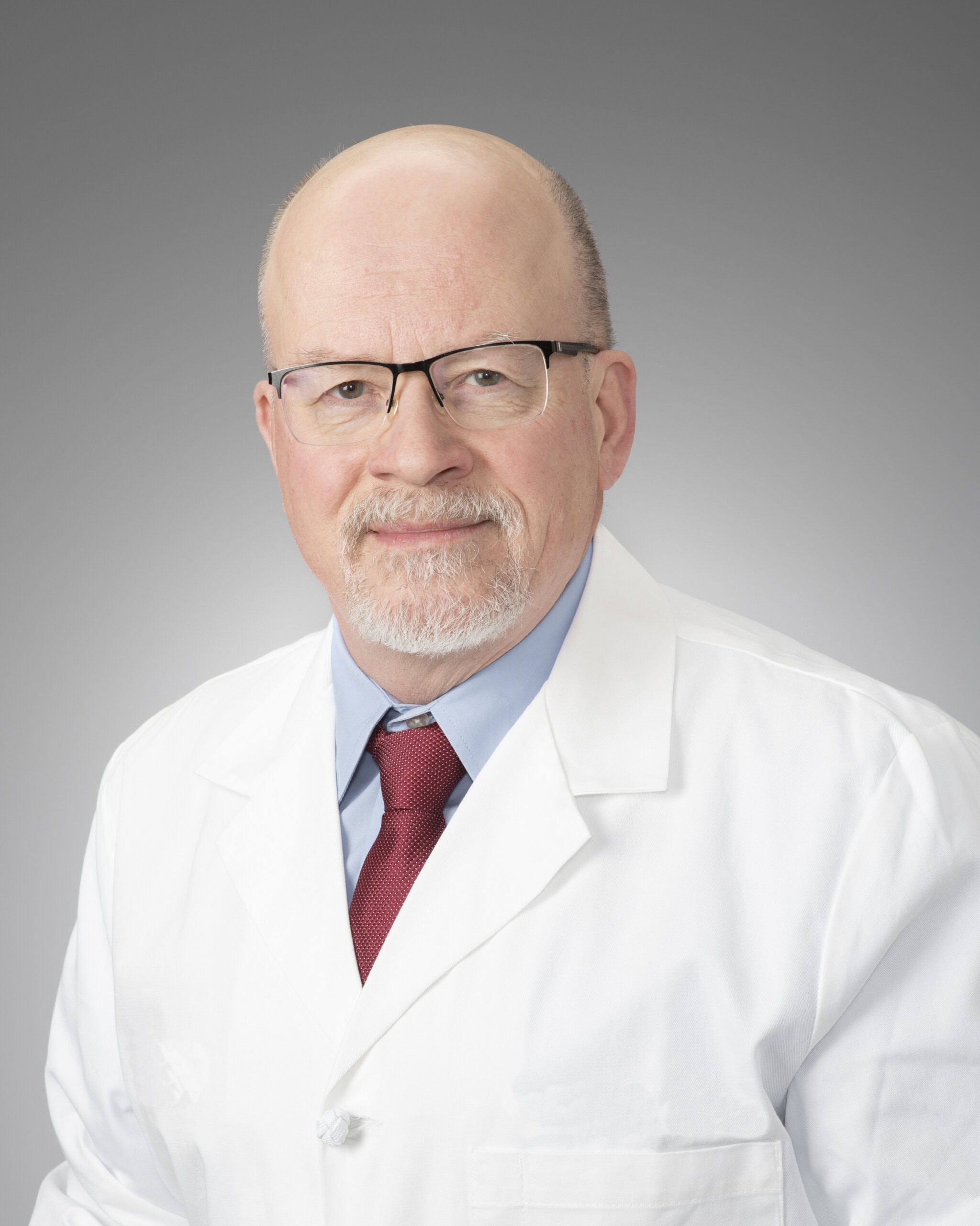 Dr. Vanek in a white lab coat